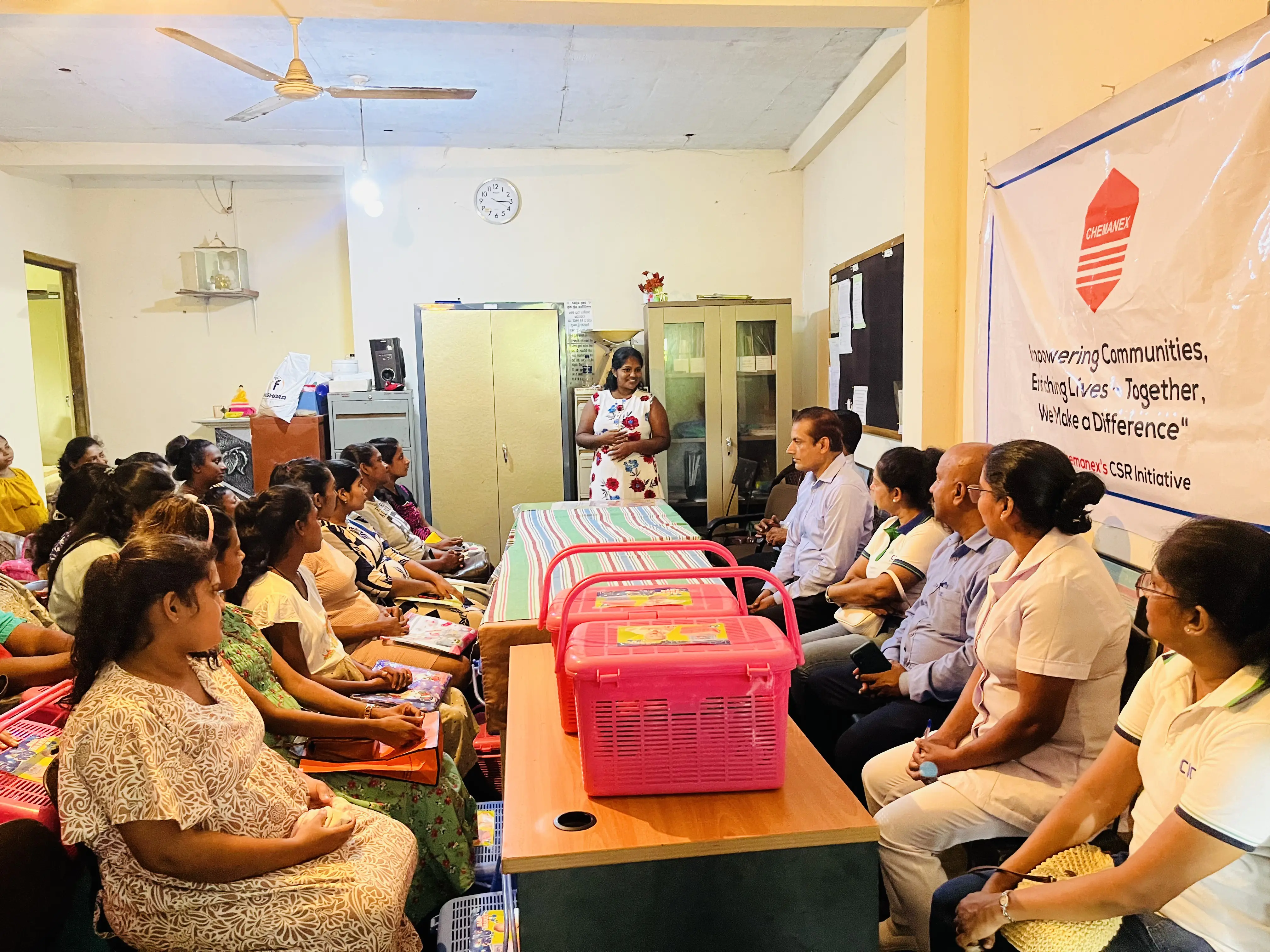 A pregnent lady speaking at a CSR event conducted by Chemanex PLC